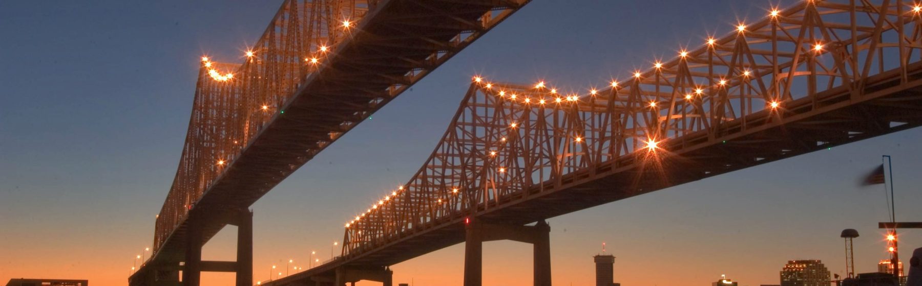 Crescent city connection bridge in New Orleans, lit up at night